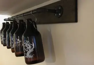 How to display your beer growlers hanging in a row from hooks